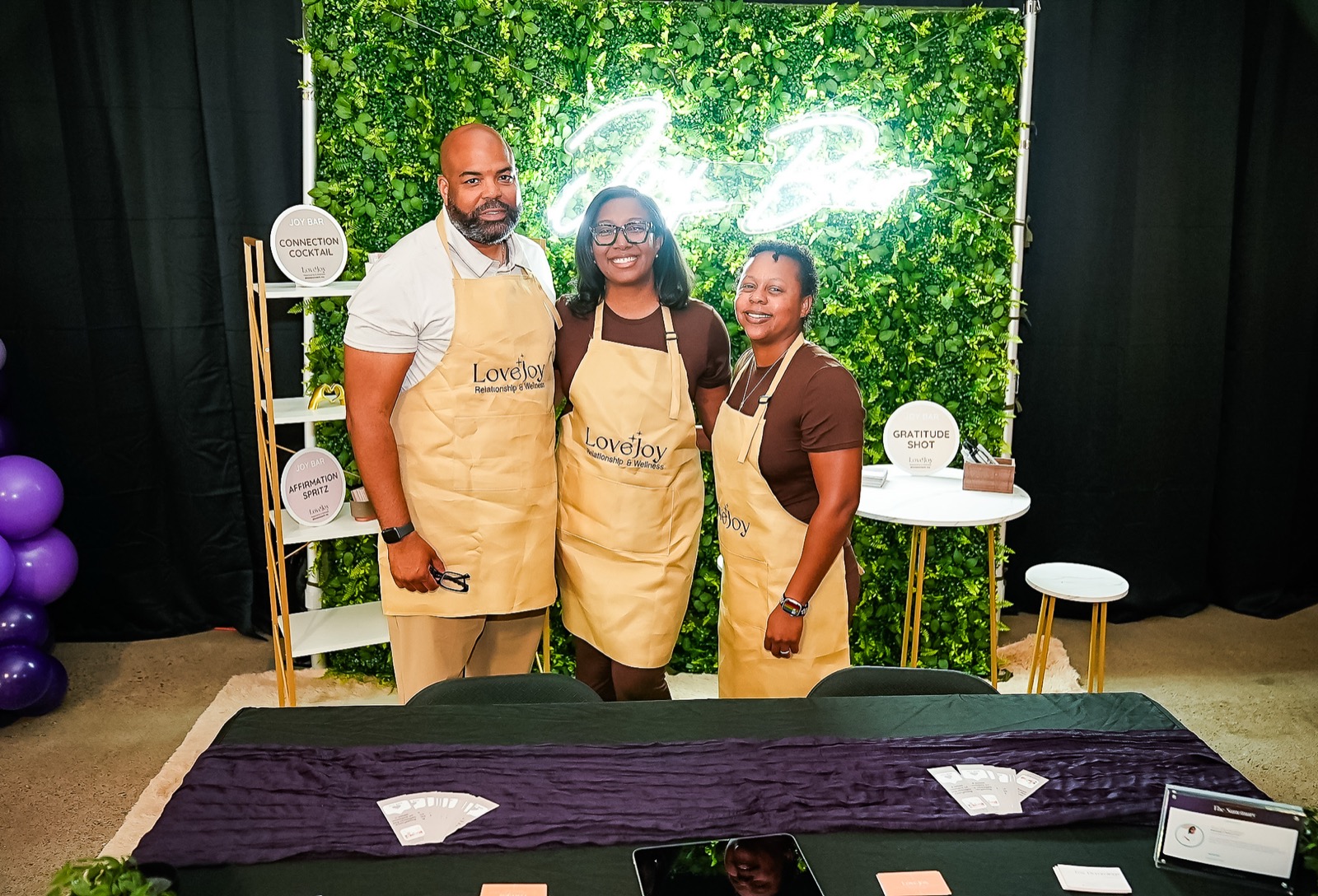 The LoveJoy team at their neon booth